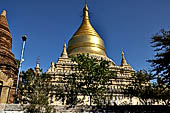 Bagan Myanmar. Next to the Gubyaukgyi stands the gilded Myazedi or 'Emerald Stupa'. 